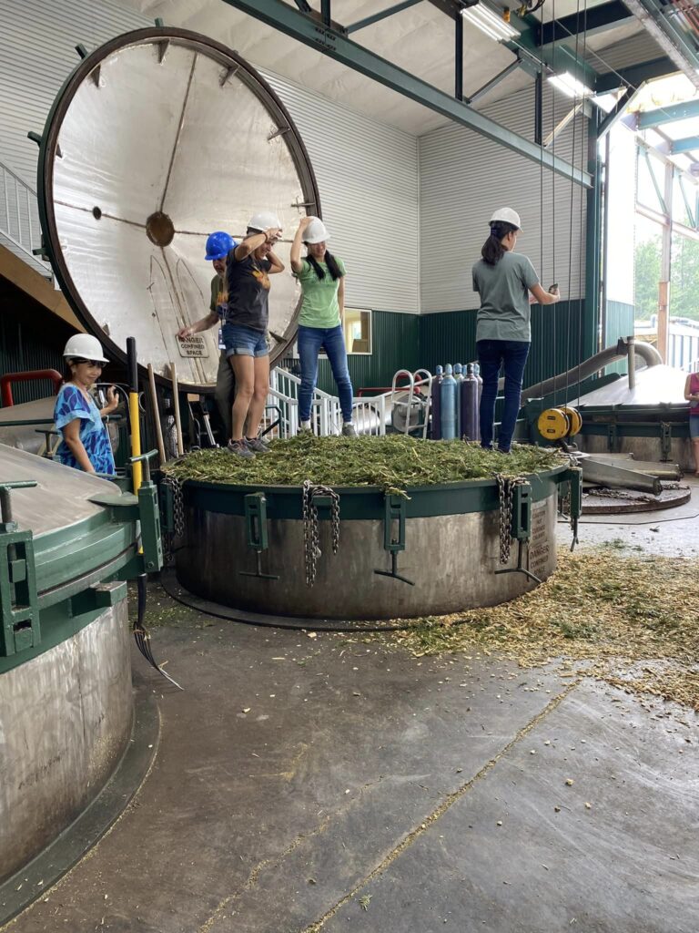 CARE Summit 2023 at Highland Flats Tree Farm -September 2023 6 15. CARE Instructors packing down Grand Fir material into the distiller