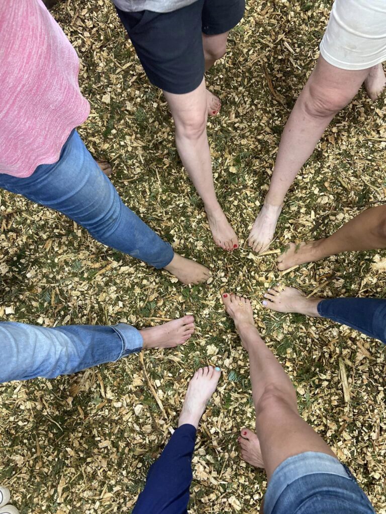 CARE Summit 2023 at Highland Flats Tree Farm -September 2023 9 16. Instructors’ feet atop Grand Fir material that is about to be steam distilled