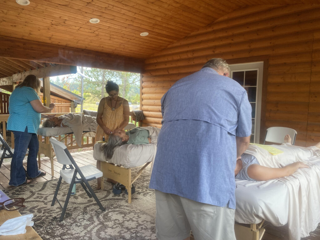 CARE Summit 2023 at Highland Flats Tree Farm -September 2023 14 17. Students in Advanced Emotional Release class practicing facilitated releases